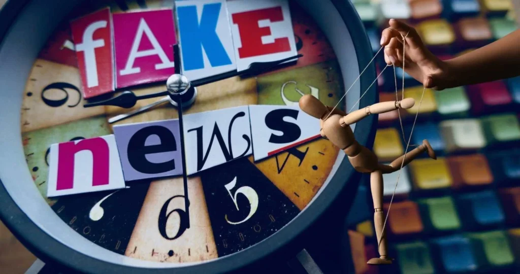 Image containing the text "fake news" and a wooden puppet being controlled by strings metaphorically depicting modern media manipulation.