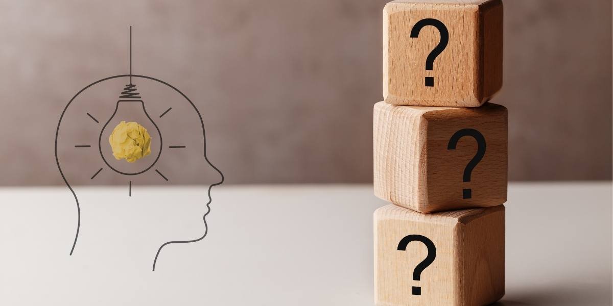 Wooden question blocks and illuminated mind illustration for overcoming the feeling of being behind in life.