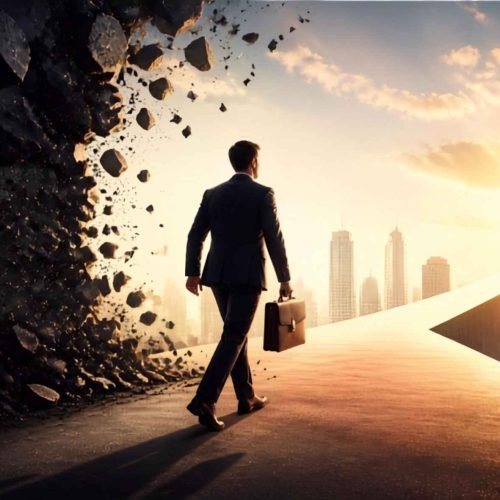 Businessman walking through a crumbling wall toward a bright city skyline, symbolizing how to overcome fear in business.